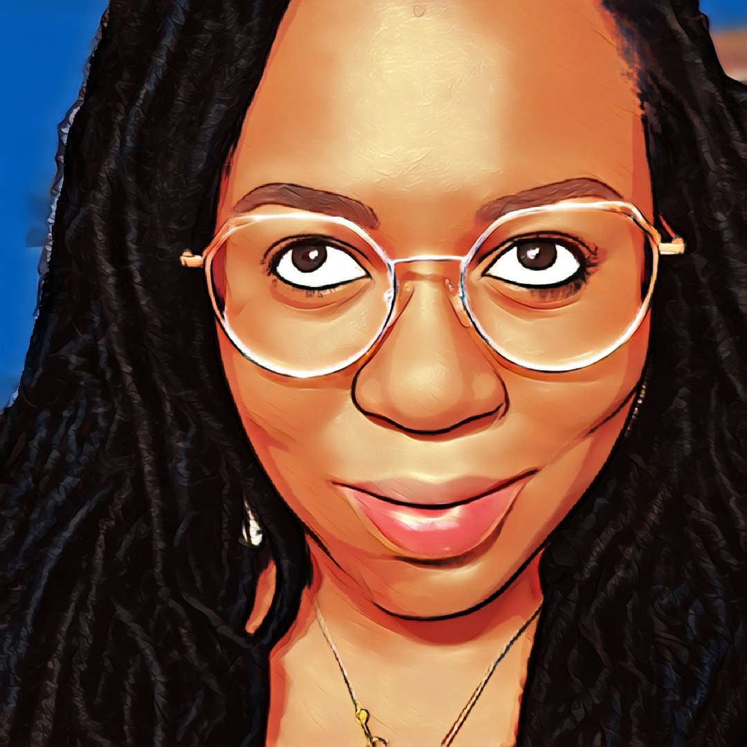 Astride Noel with long locs and cute glasses, grinning as she looks upward.