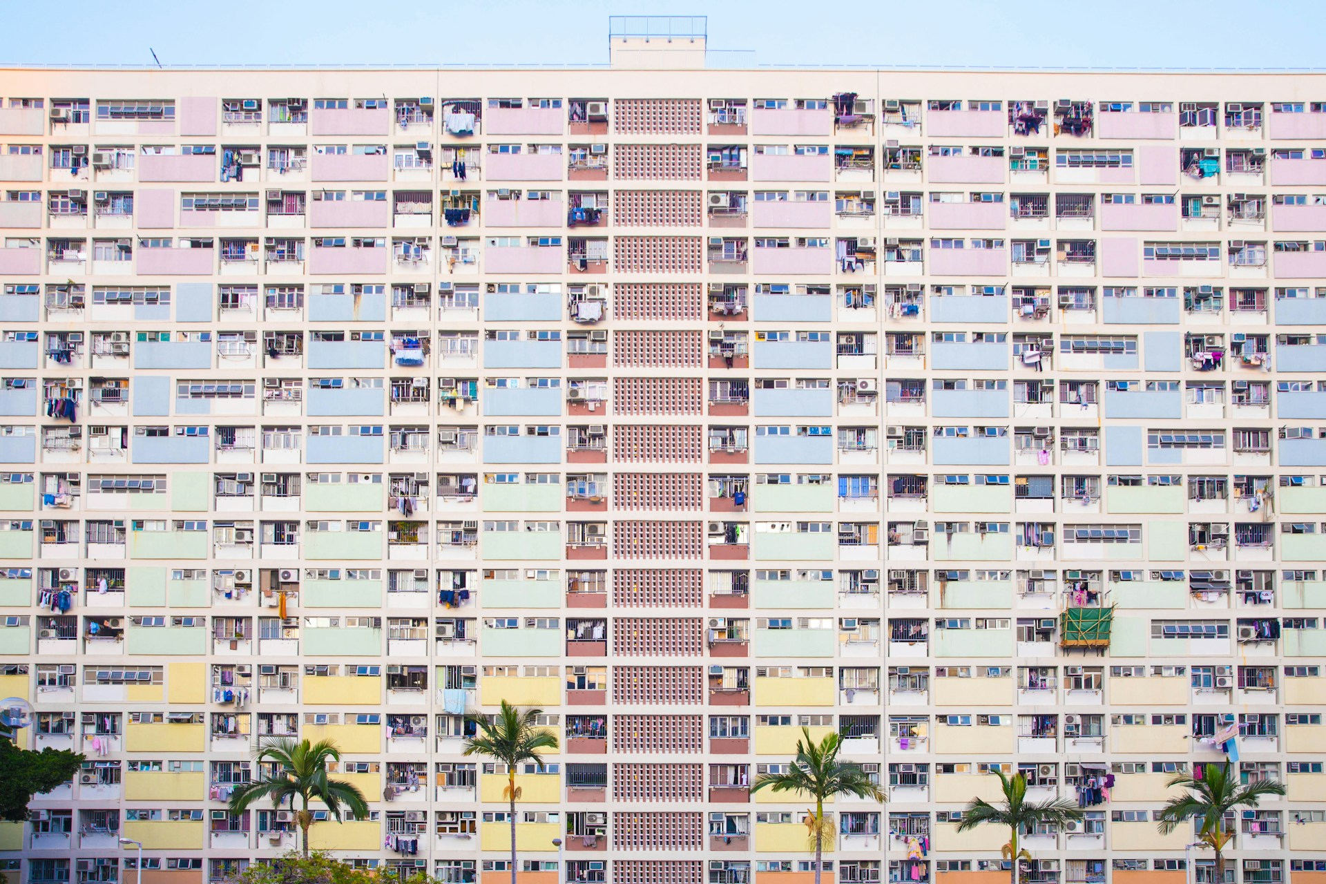 white concrete high rise building by Carla Martinesi