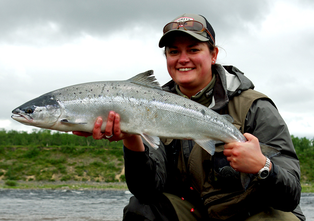 Fisherman holding a large salmon