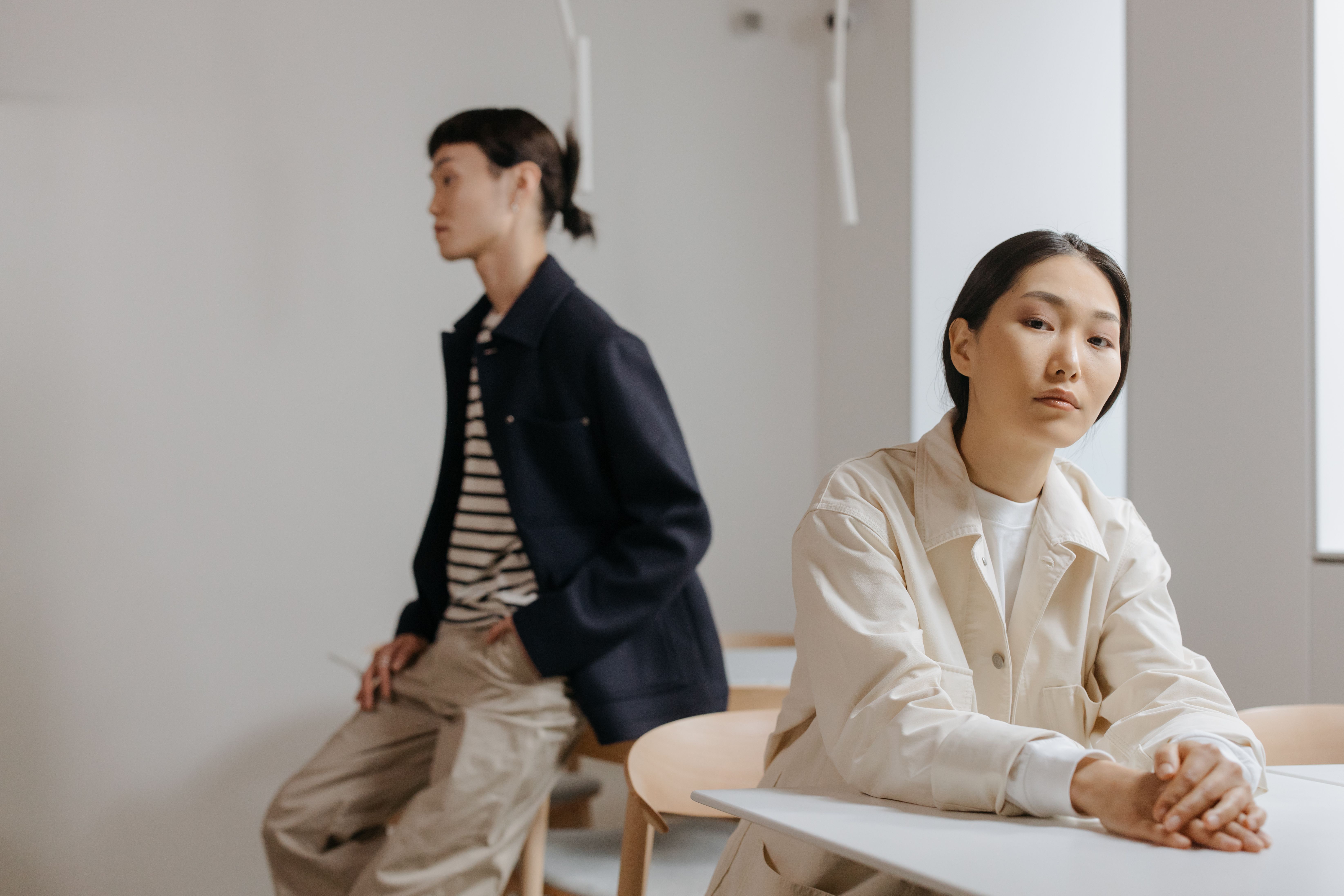 Two models in a minimalist, modern setting