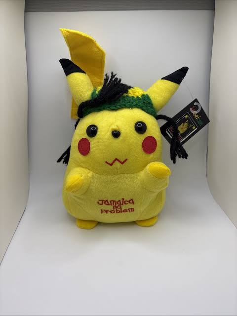 Picture of a bootleg Pikachu plushie in a white enclosed pace. Pikachu posseses a Jamacian hat, dreadlocks, and on its stomach reads Jamacia no Problem