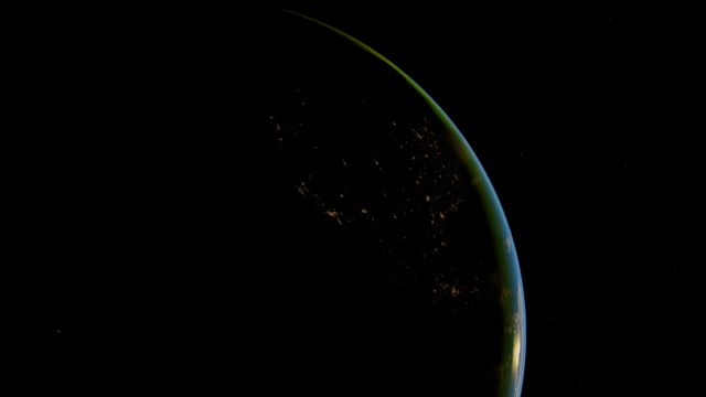 Silhoutte of the Earth against a space background
