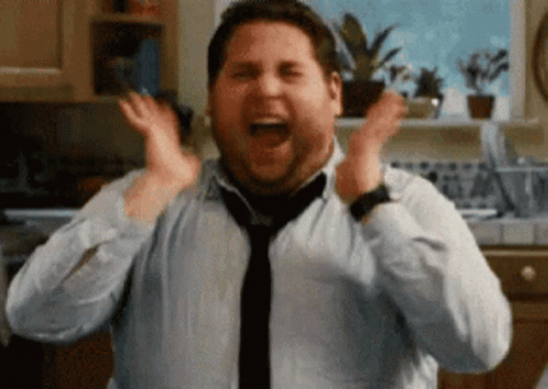 Animated gif of Jonah Hill screaming hystercally and moving his head side to side flash on the screen